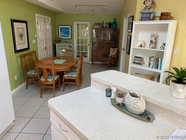 a living room with hard wood flooring and furniture