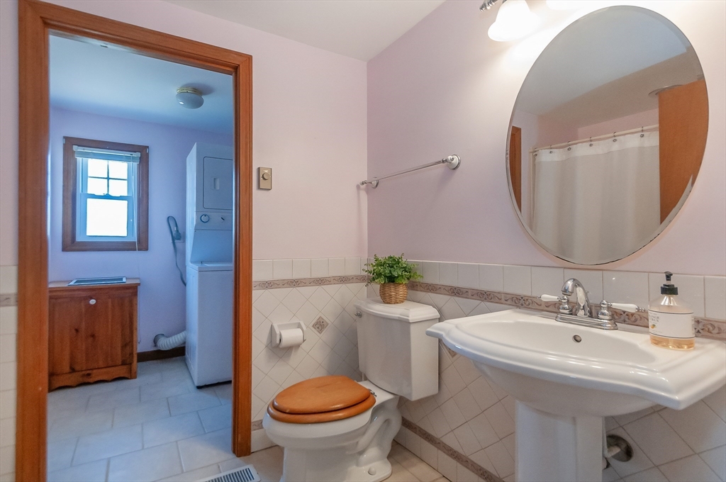 7 Roosevelt Street Wareham, MA 02571 - Photo 15 of 29 a bathroom with a sink toilet and mirror