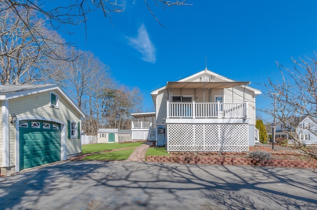 7 Roosevelt Street Wareham, MA 02571 - Photo 24 of 29 a front view of a house with a yard