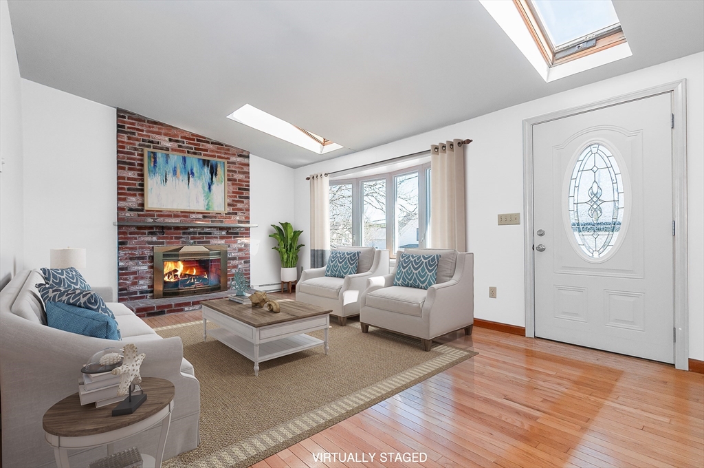 7 Roosevelt Street Wareham, MA 02571 - Photo 8 of 29 a living room with furniture and a fireplace