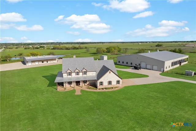 a view of a lake with a yard