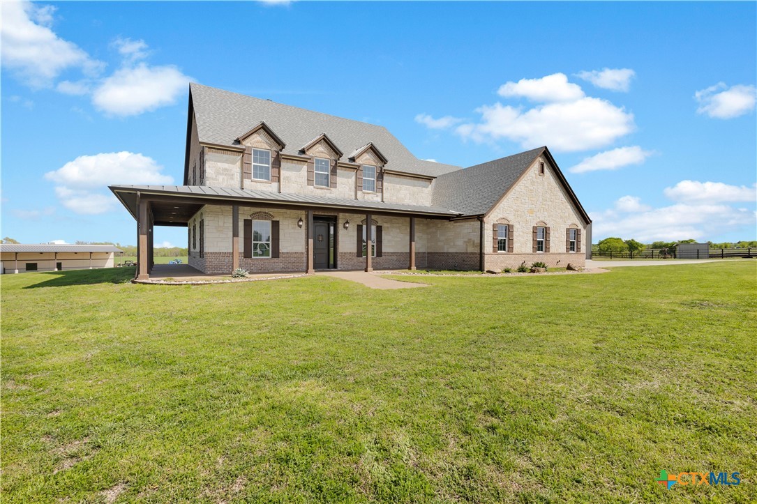 12491 Madison Lane Justin, TX 76247 - Photo 16 of 38 a front view of a house with garden