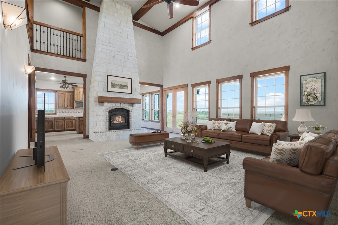 12491 Madison Lane Justin, TX 76247 - Photo 17 of 38 a living room with furniture large window and a fireplace