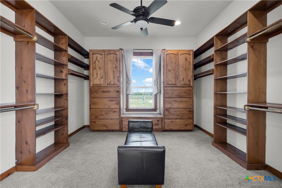 12491 Madison Lane Justin, TX 76247 - Photo 23 of 38 a view of walk in closet with empty racks