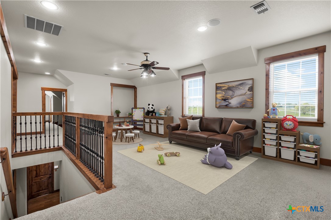 12491 Madison Lane Justin, TX 76247 - Photo 28 of 38 a living room with furniture and a flat screen tv