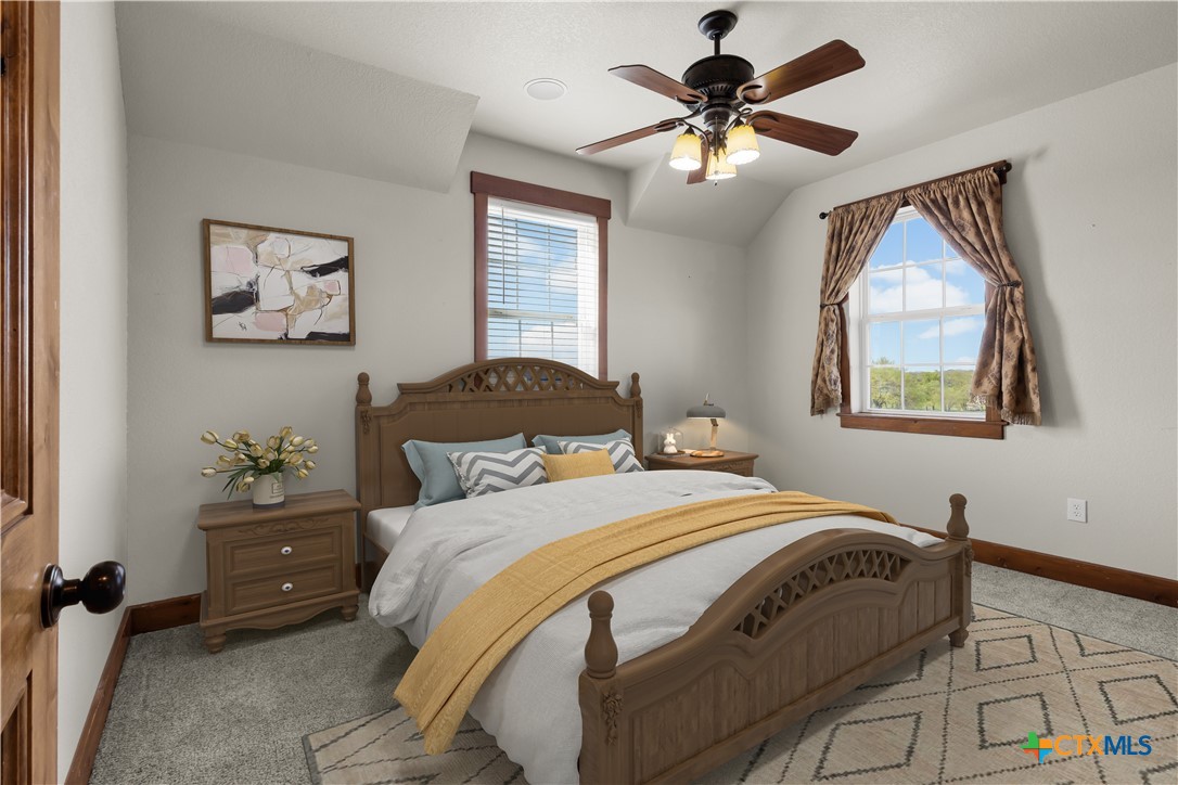 12491 Madison Lane Justin, TX 76247 - Photo 31 of 38 a bedroom with a bed and a window