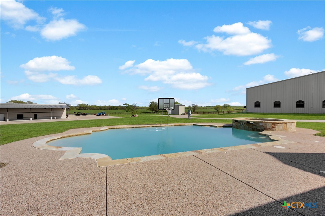 12491 Madison Lane Justin, TX 76247 - Photo 33 of 38 a view of swimming pool with outdoor seating and yard
