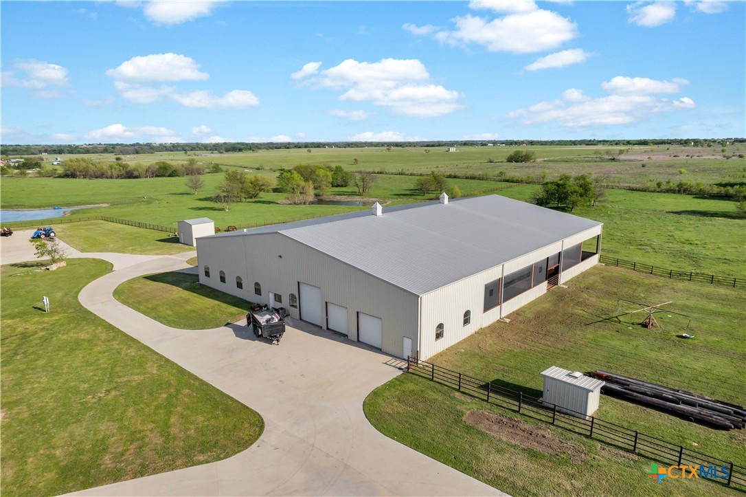 12491 Madison Lane Justin, TX 76247 - Photo 34 of 38 an aerial view of a house with outdoor space and a lake view