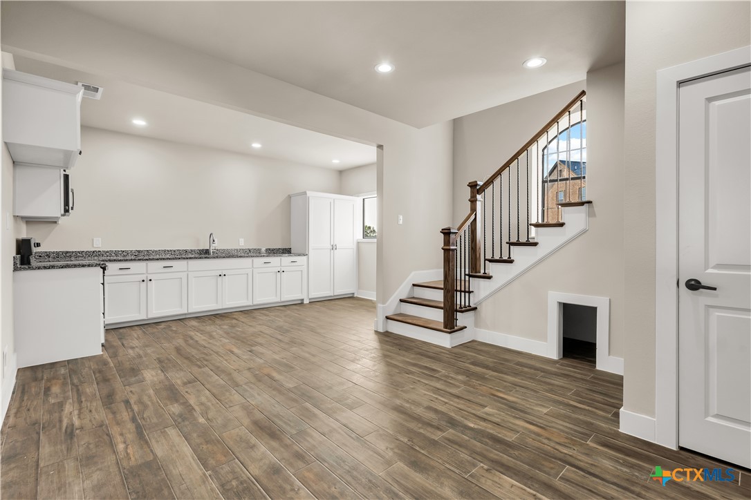 12491 Madison Lane Justin, TX 76247 - Photo 36 of 38 a view of an entryway wooden floor and staircase