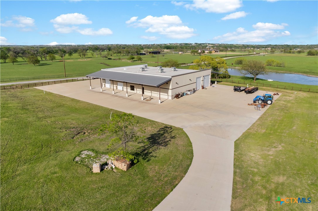 12491 Madison Lane Justin, TX 76247 - Photo 10 of 38 a view of a swimming pool with an ocean view