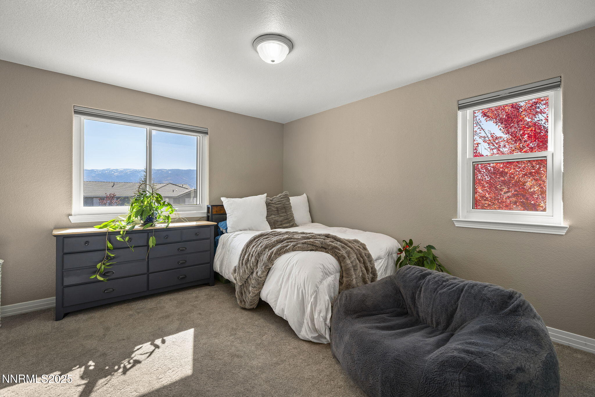 7159 Windstar Drive Reno, NV 89523 - Photo 19 of 33 a bed room with a bed and a couch