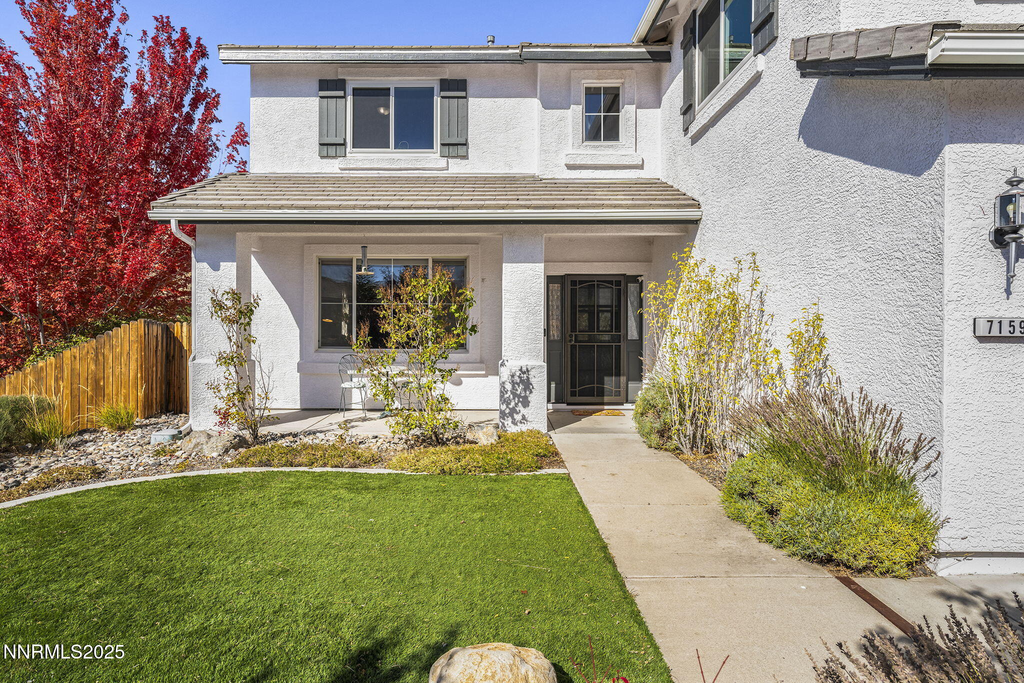 7159 Windstar Drive Reno, NV 89523 - Photo 3 of 33 a front view of a house with garden