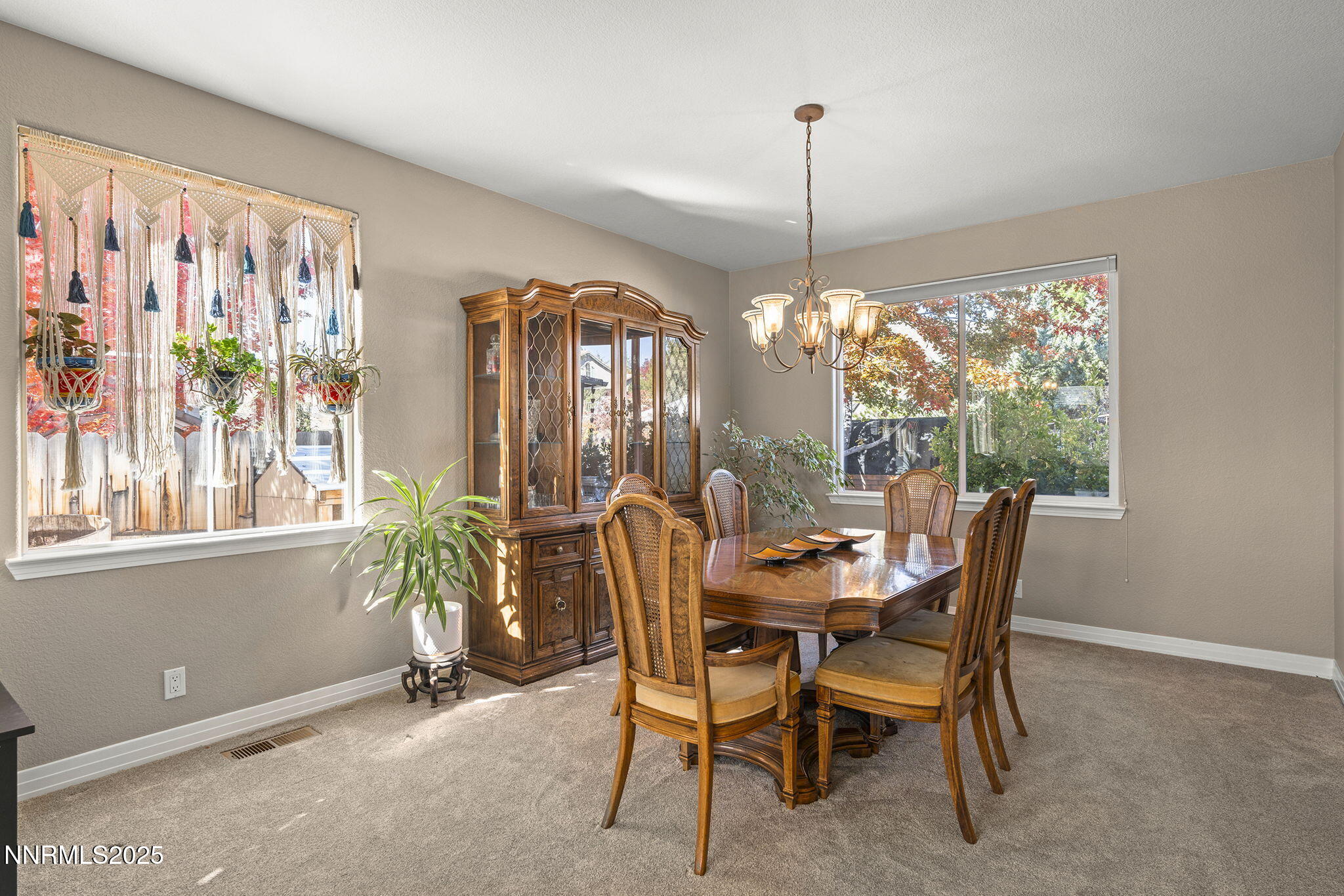 7159 Windstar Drive Reno, NV 89523 - Photo 6 of 33 a dining room with furniture window and chandelier