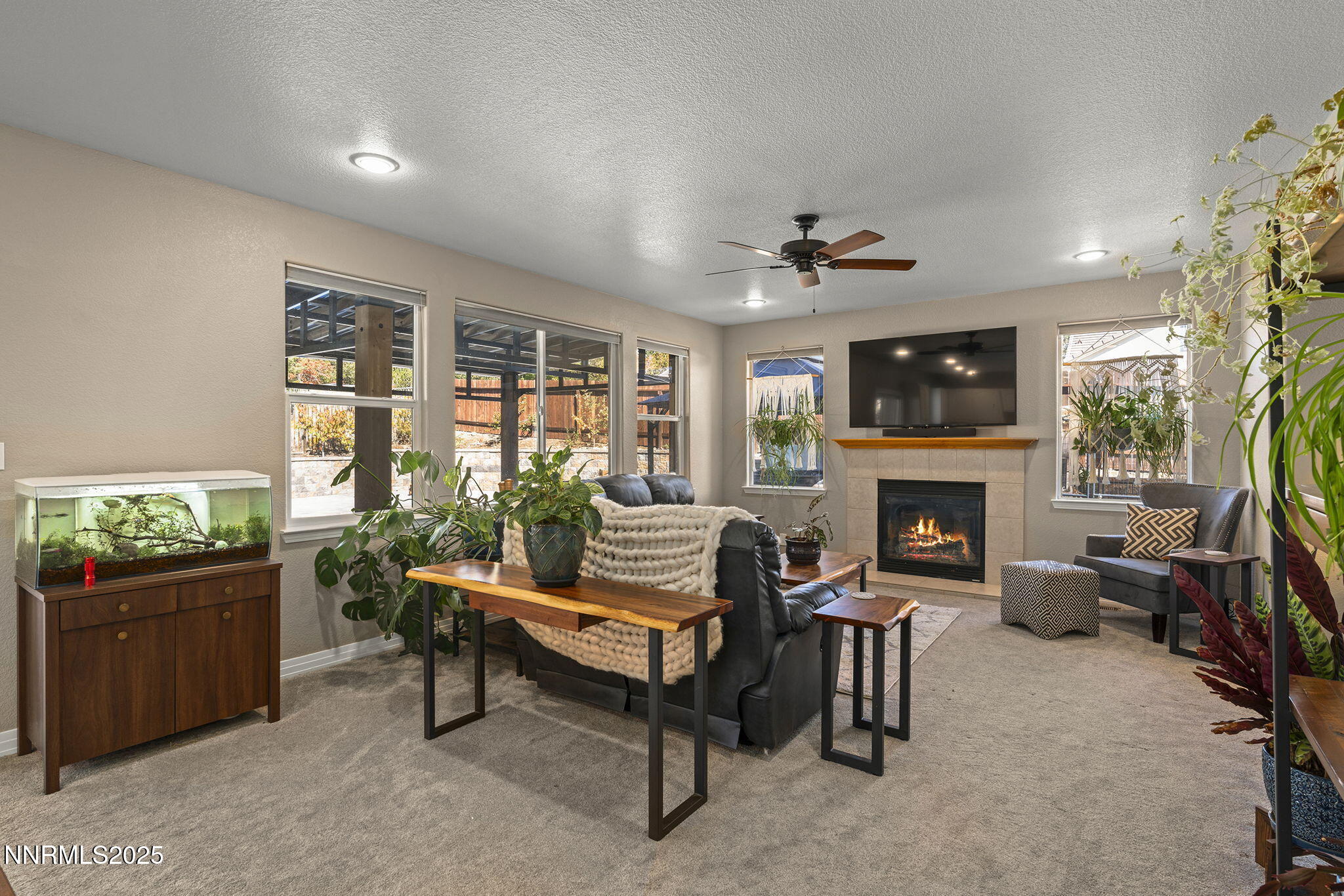 7159 Windstar Drive Reno, NV 89523 - Photo 7 of 33 a living room with furniture and a fireplace