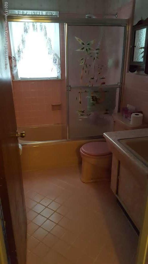 2674 Allenwood Lakewood Road, Unit R Howell, NJ 07731 - Photo 5 of 7 a bathroom with a toilet a sink and tub