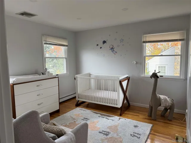 a bedroom with furniture and windows