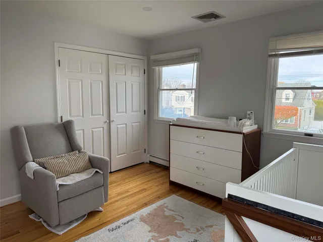 a living room with furniture and windows