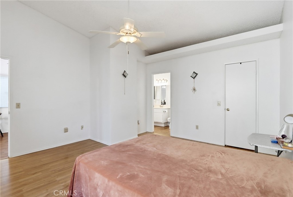 29350 Murrieta Road Menifee, CA 92586 - Photo 22 of 31 a view of a bedroom with wooden floor