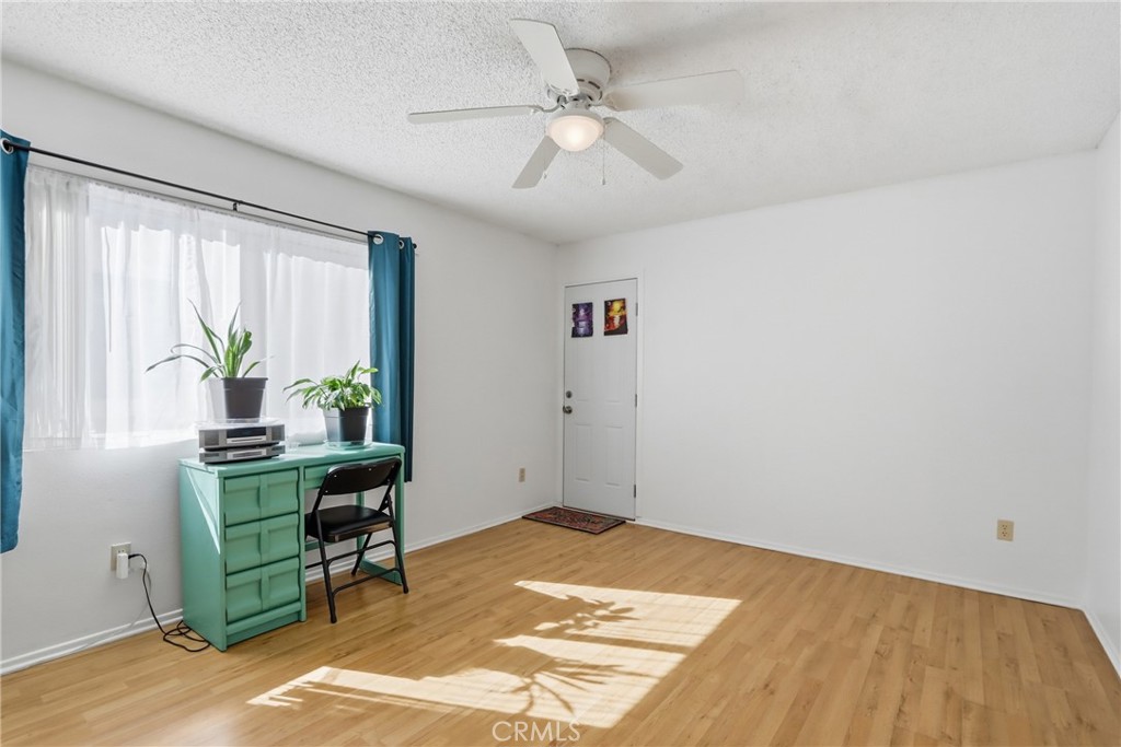 29350 Murrieta Road Menifee, CA 92586 - Photo 23 of 31 a view of a workspace with furniture and a window