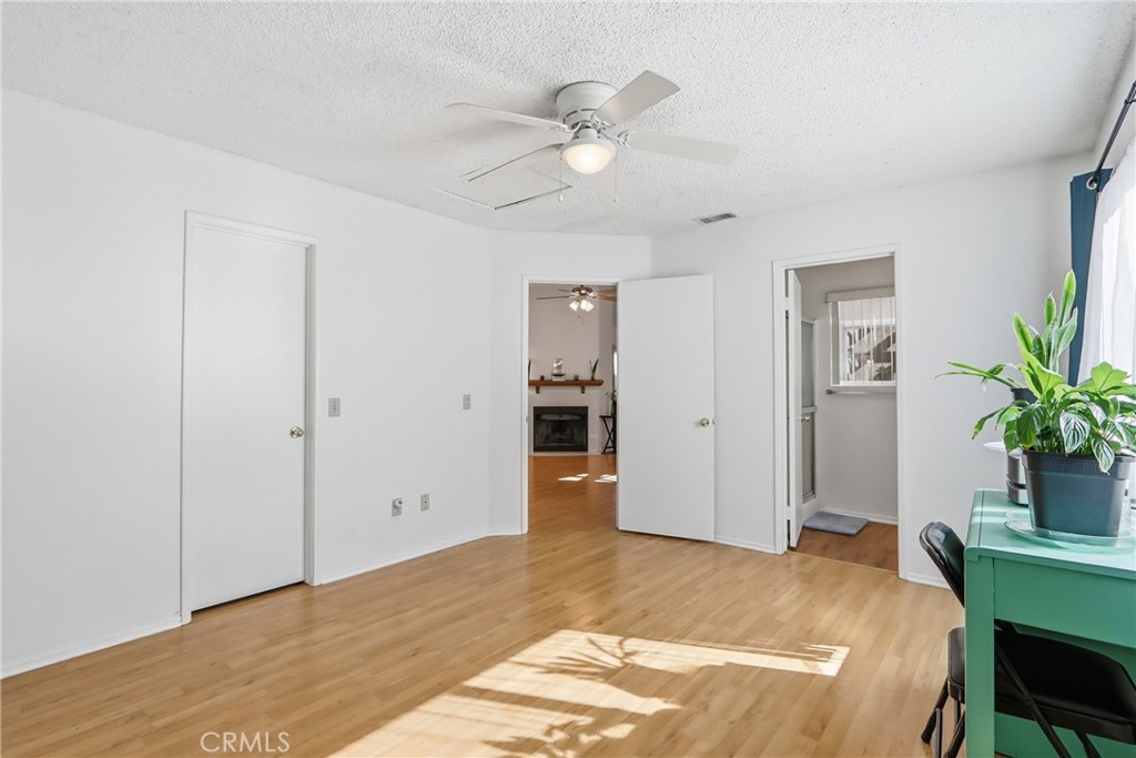 29350 Murrieta Road Menifee, CA 92586 - Photo 24 of 31 a bedroom with a bed and a potted plant