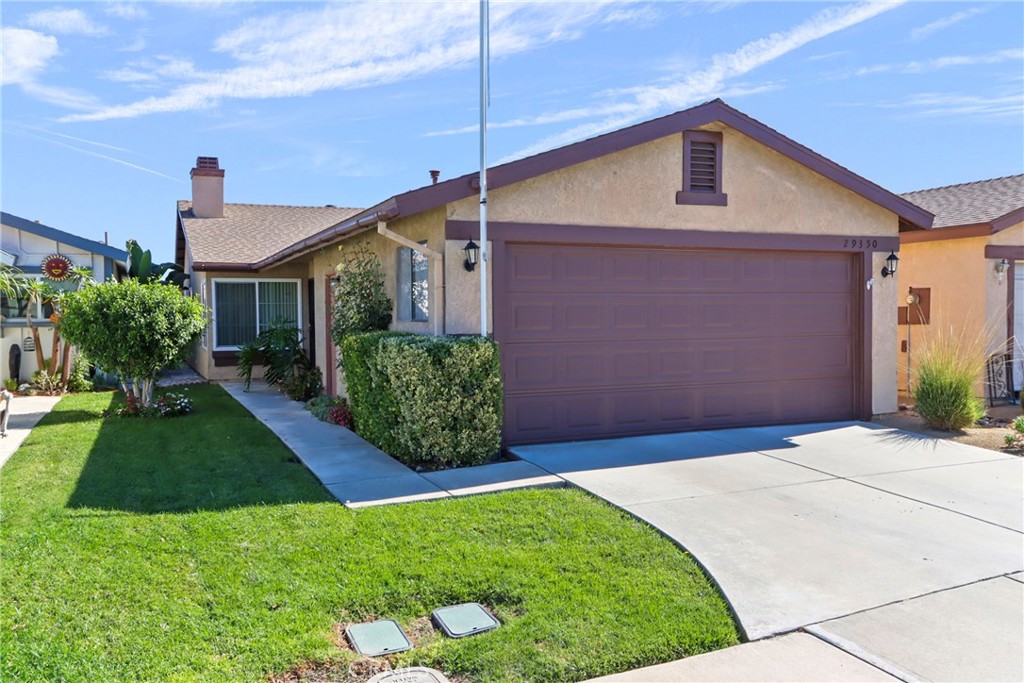 29350 Murrieta Road Menifee, CA 92586 - Photo 4 of 31 a front view of a house with a yard