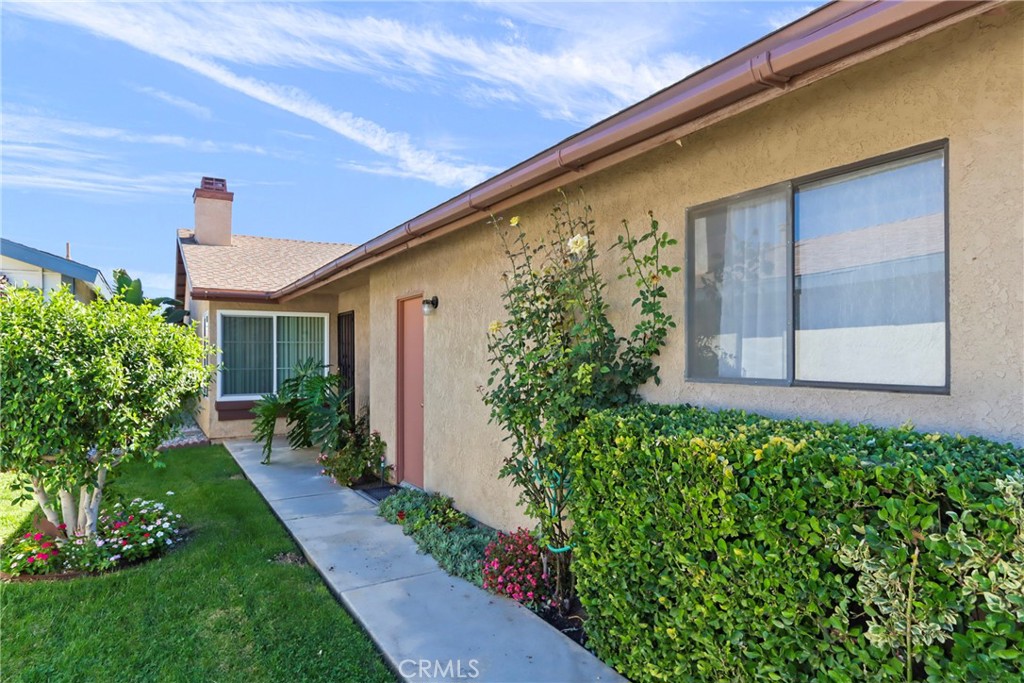 29350 Murrieta Road Menifee, CA 92586 - Photo 5 of 31 a front view of a house with a yard