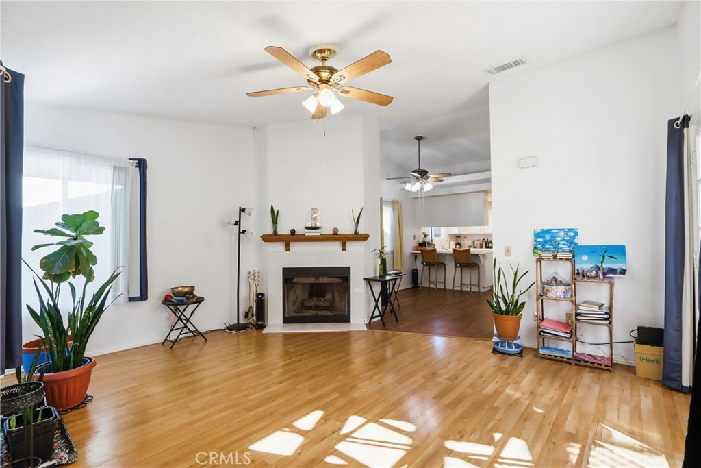 29350 Murrieta Road Menifee, CA 92586 - Photo 7 of 31 a living room with furniture and a fireplace