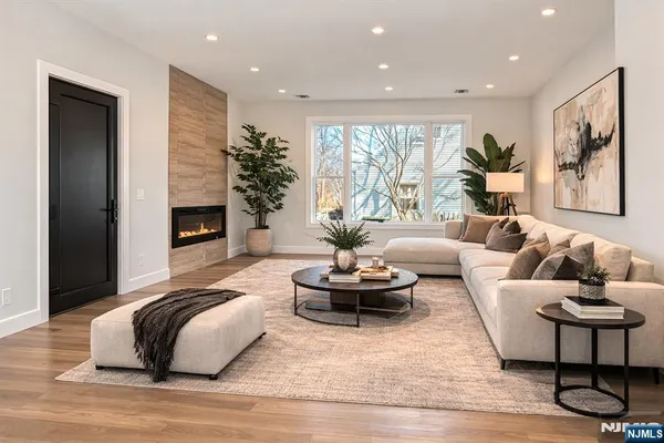 a living room with furniture and a fireplace
