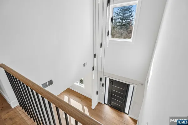 a view of an entryway with wooden floor