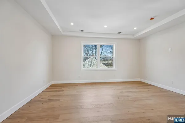 wooden floor in a room with a window