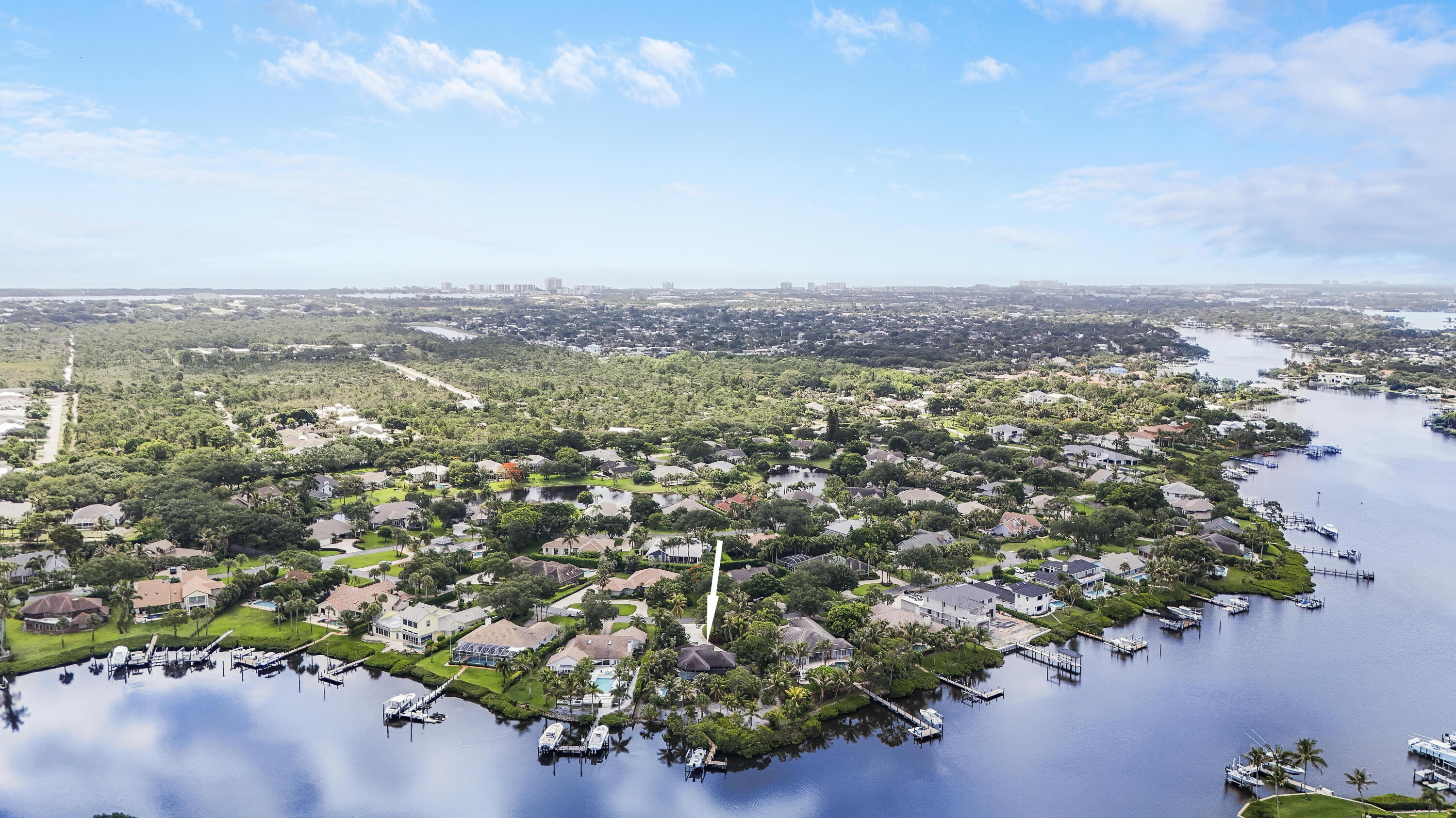 18791 Southeast River Ridge Road Jupiter, FL 33469 - Photo 6 of 25 an aerial view of a city with lots of residential buildings