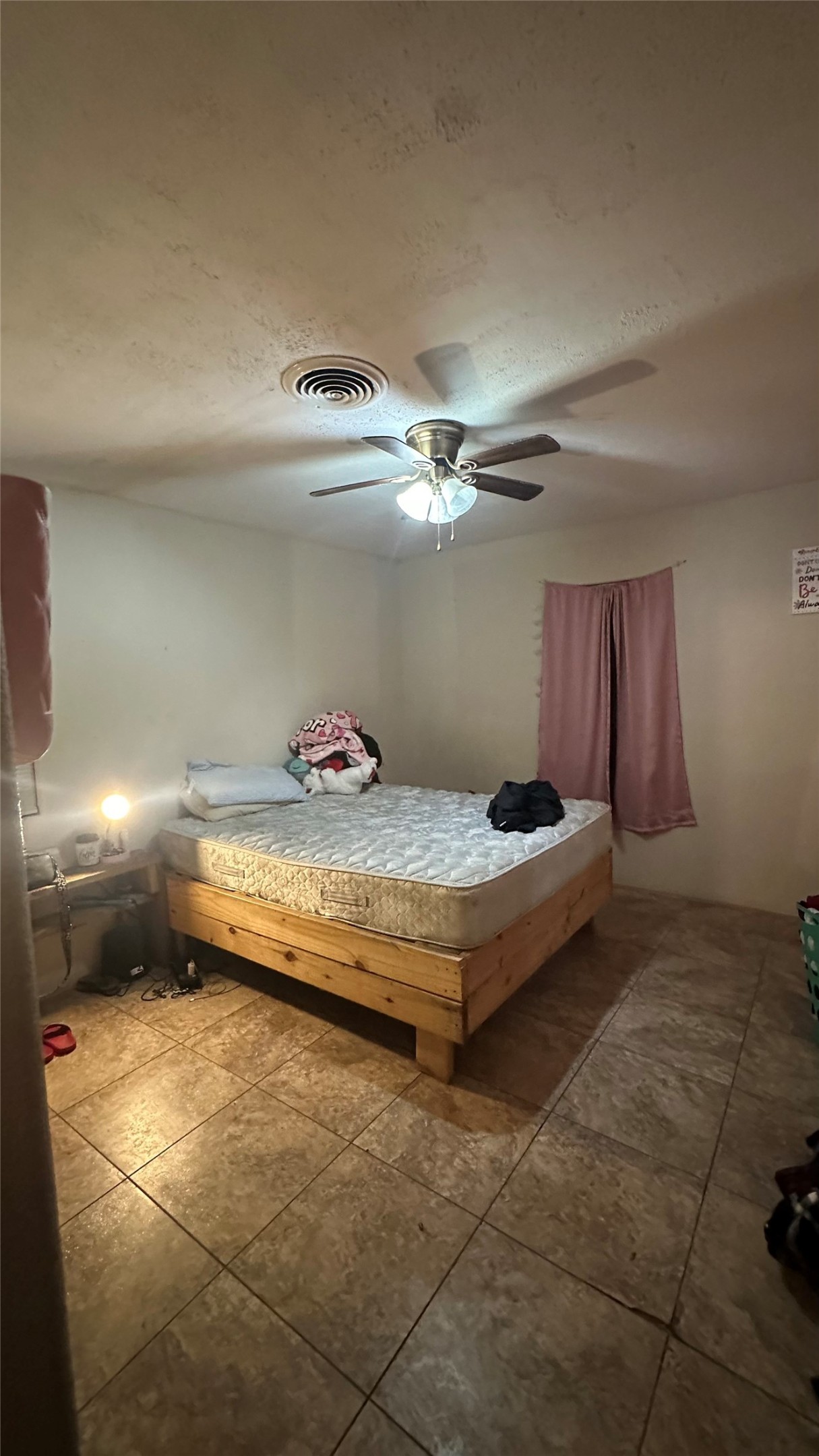 414 Frydek Road Sealy, TX 77474 - Photo 11 of 22 a bedroom with a bed and a chandelier