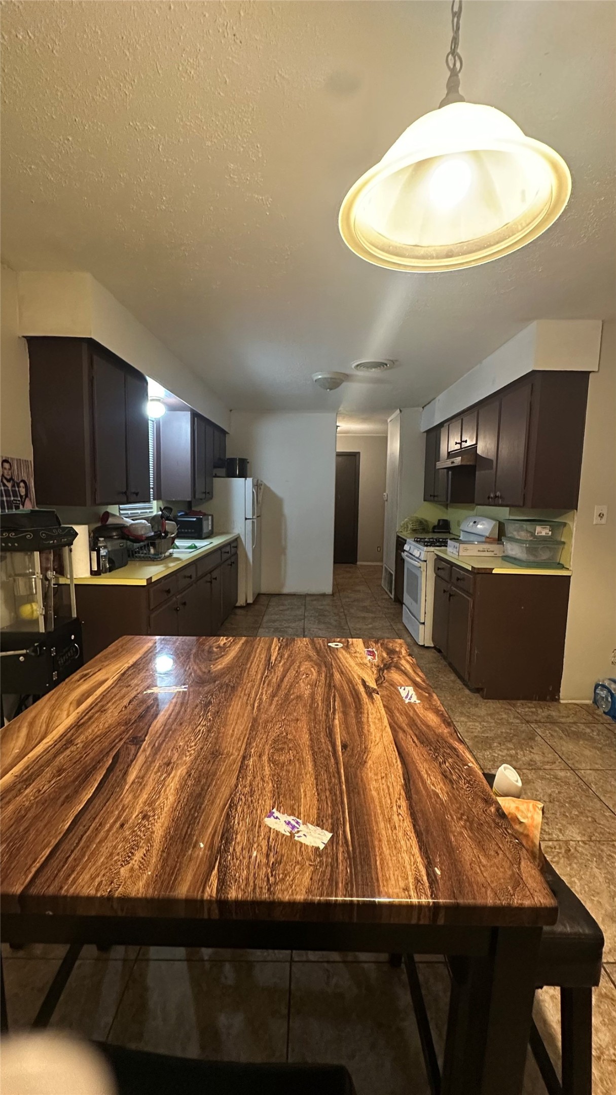 414 Frydek Road Sealy, TX 77474 - Photo 13 of 22 a room with kitchen island a stove and a sink