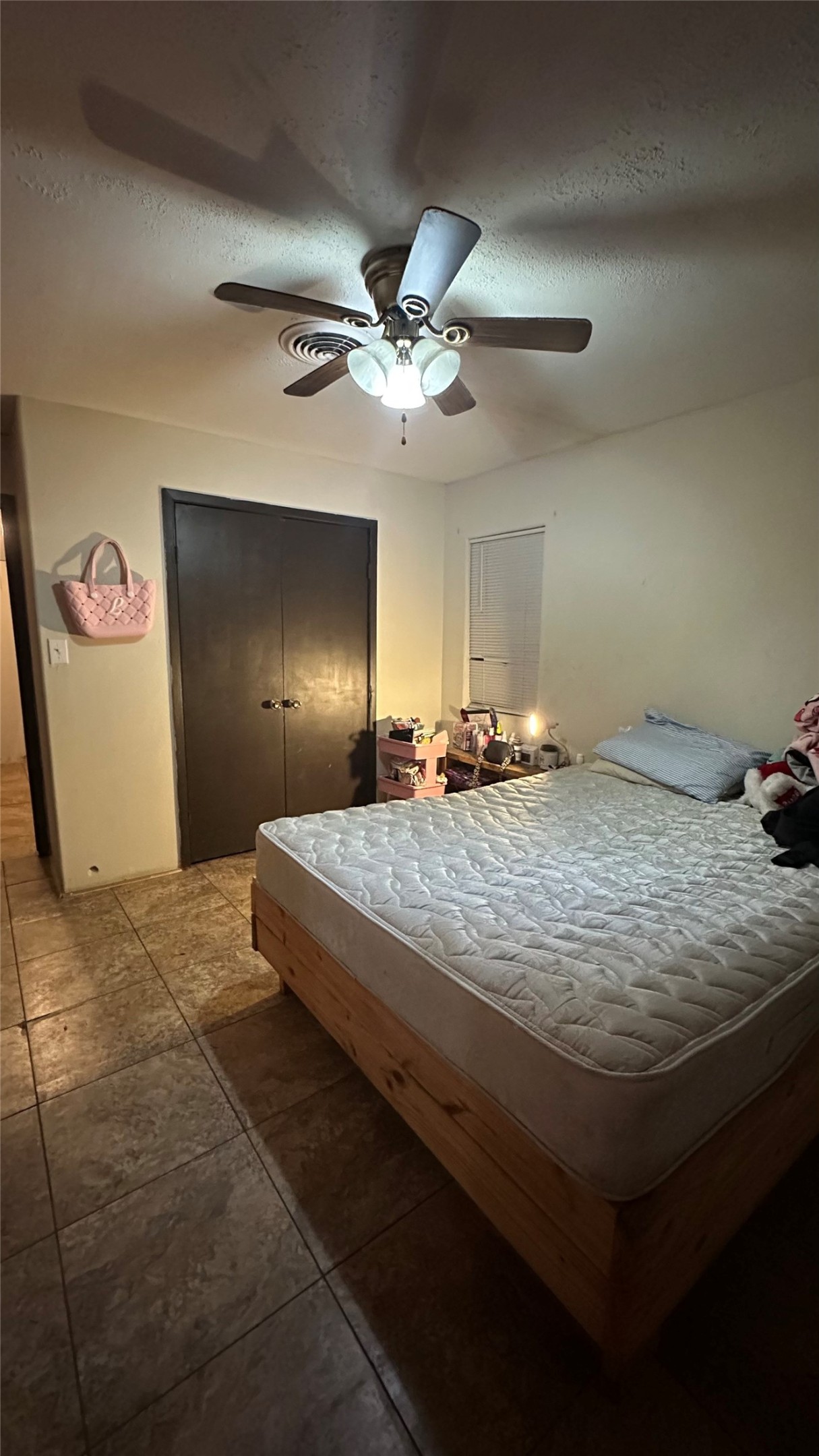 414 Frydek Road Sealy, TX 77474 - Photo 16 of 22 a bedroom with a bed and a ceiling fan