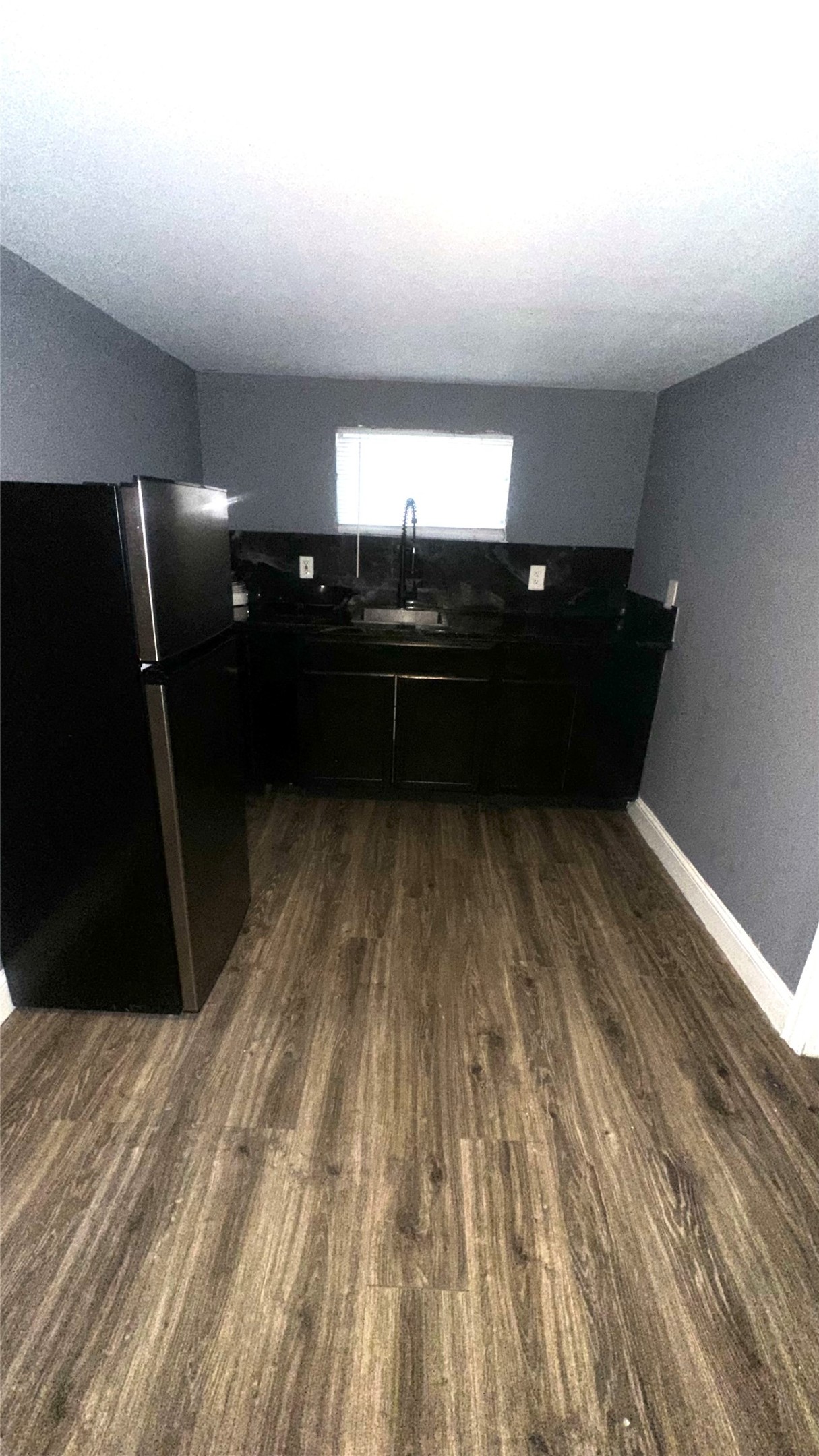 414 Frydek Road Sealy, TX 77474 - Photo 10 of 22 a room with water heater and wooden floor