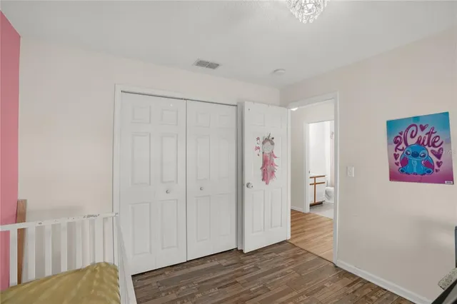 a workspace room with furniture and wooden floor