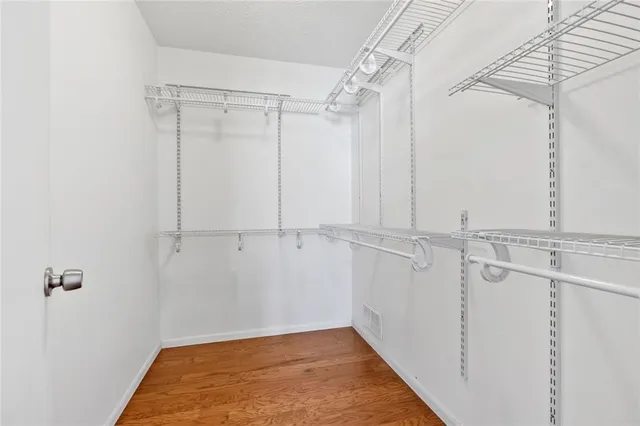 a bathroom with a sink vanity granite and a mirror