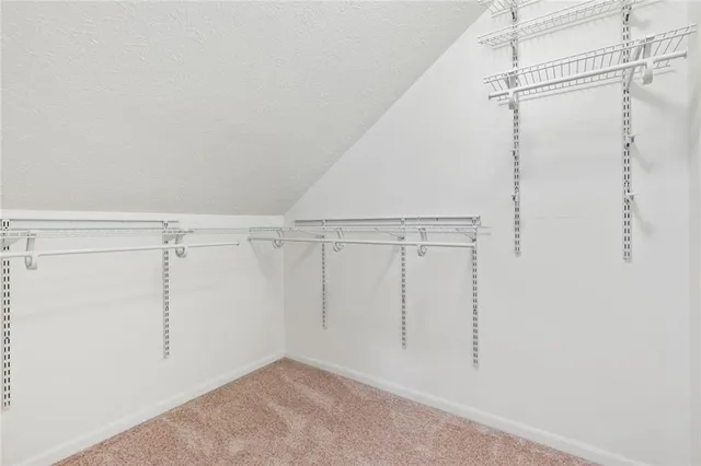 a view of a patio with table and chairs and potted plants