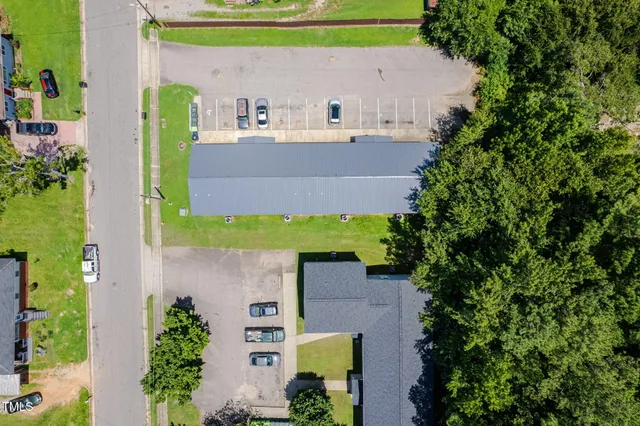 an aerial view of a house with outdoor space and street view