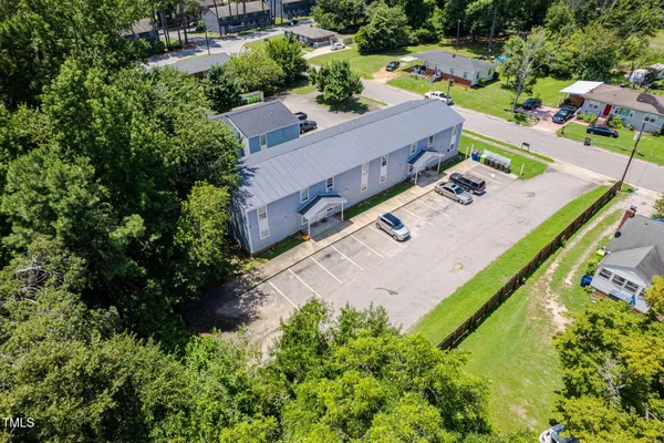 an aerial view of a house with outdoor space