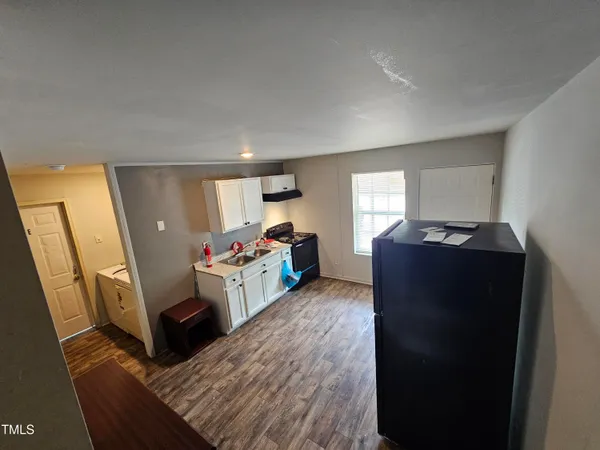 a view of living room with furniture and a flat screen tv
