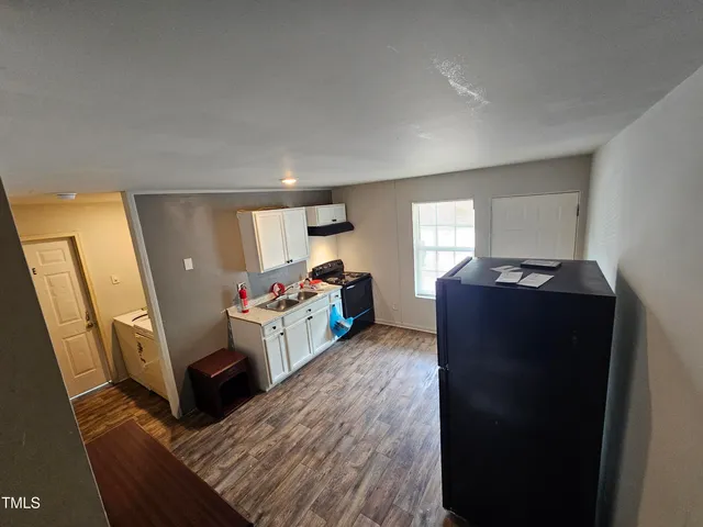 a view of living room with furniture and a flat screen tv