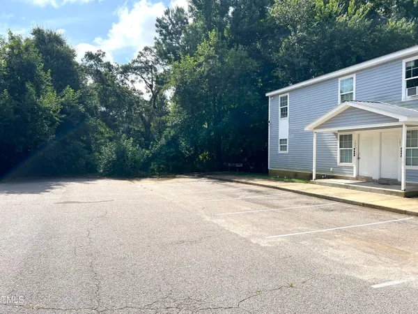 a house with trees in front of it
