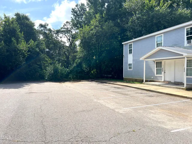 a house with trees in front of it