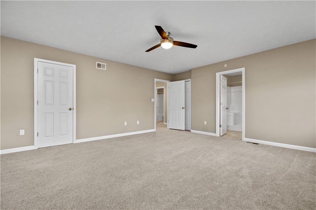 226 Lockheed Drive Coraopolis, PA 15108 - Photo 15 of 25 a view of an empty room with a ceiling fan
