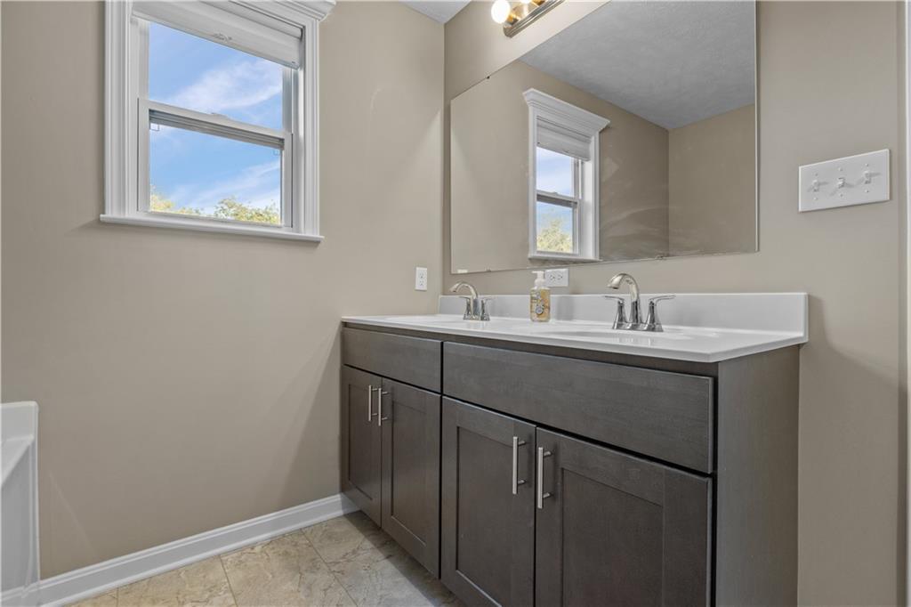 226 Lockheed Drive Coraopolis, PA 15108 - Photo 17 of 25 a bathroom with a sink and a mirror