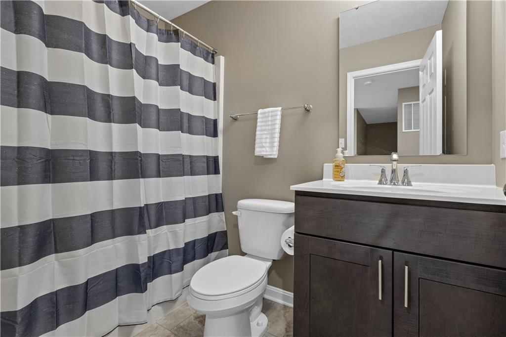226 Lockheed Drive Coraopolis, PA 15108 - Photo 21 of 25 a bathroom with a sink a toilet a mirror and shower