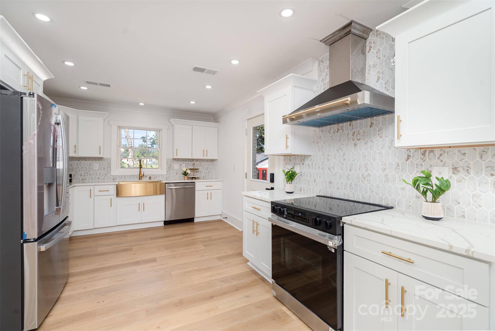 617 Jennings Road, Unit 14 Rock Hill, SC 29730 - Photo 13 of 42 a kitchen with white cabinets and appliances