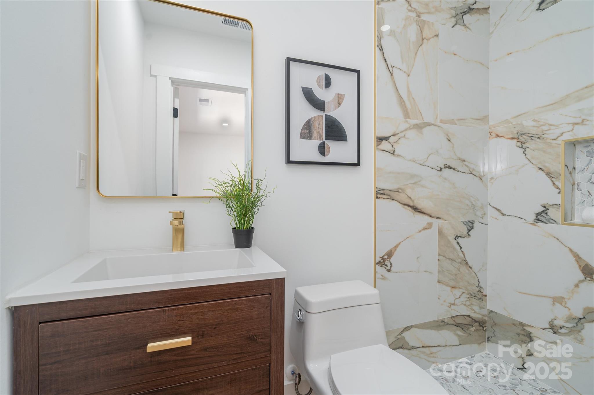 617 Jennings Road, Unit 14 Rock Hill, SC 29730 - Photo 18 of 42 a bathroom with a sink a toilet and a mirror