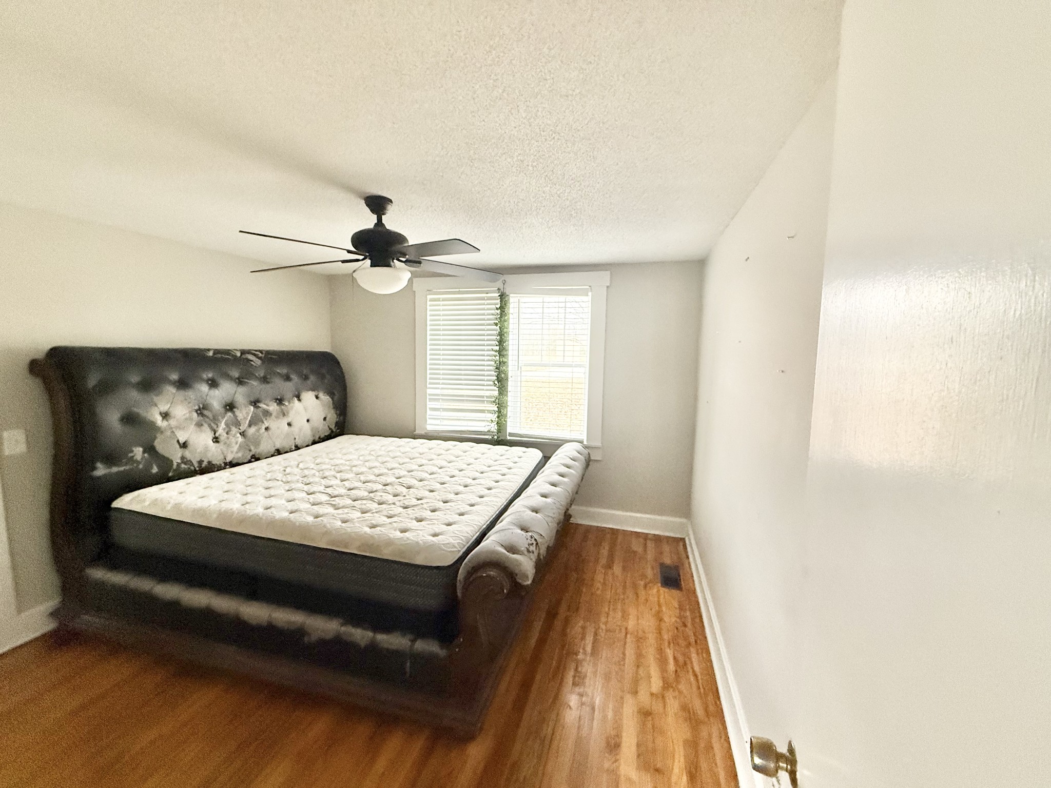 560 State Line Road Loretto, TN 38469 - Photo 7 of 9 a bedroom with a bed and a window